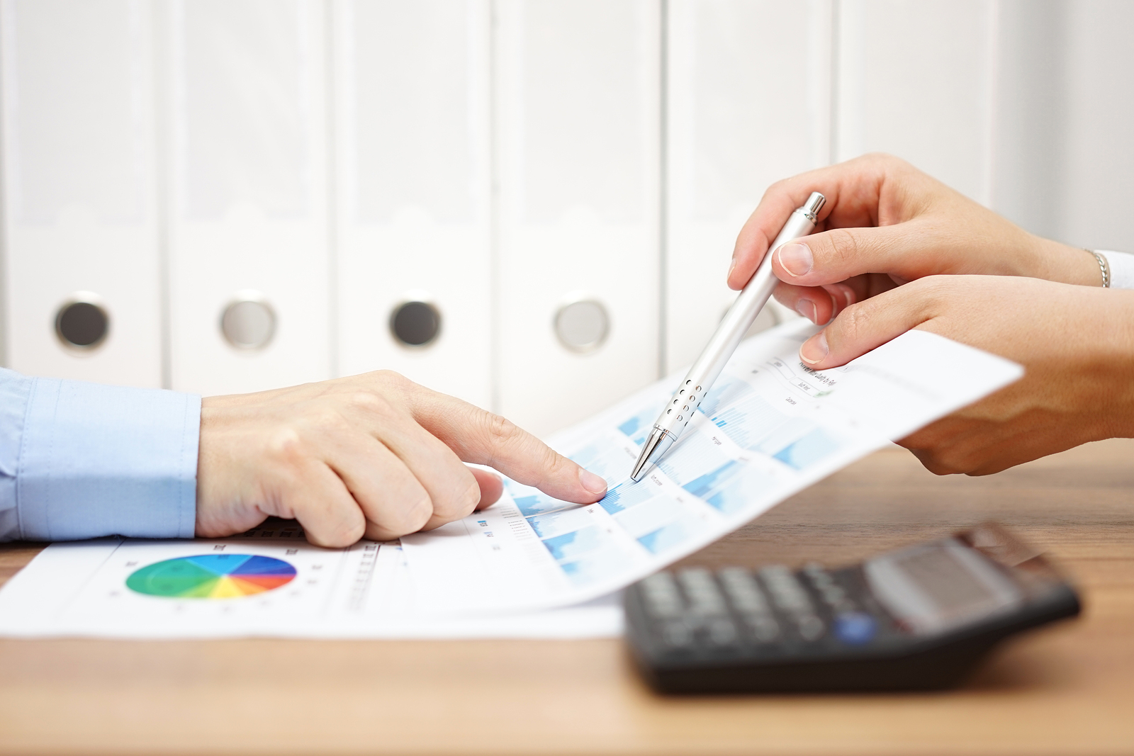 two business people on meeting analyze financial report and discussing about data
** Note: Shallow depth of field